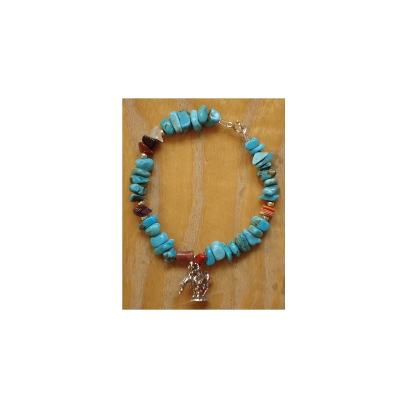 Bracelet navajo en turquoises et breloque indienne en argent.